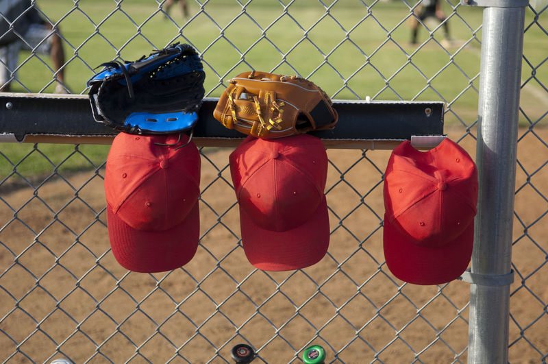Hats and gloves hanging in a tball dugout