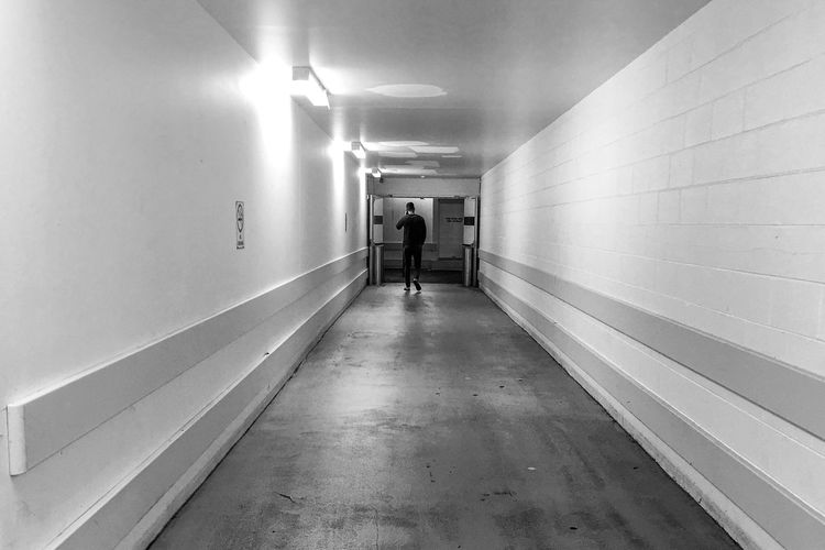 Man walking in corridor