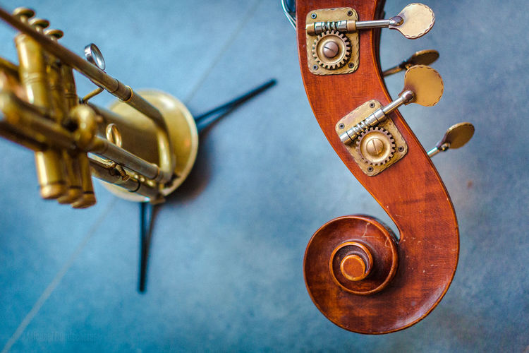 Close-up of trumpet and double bass on table