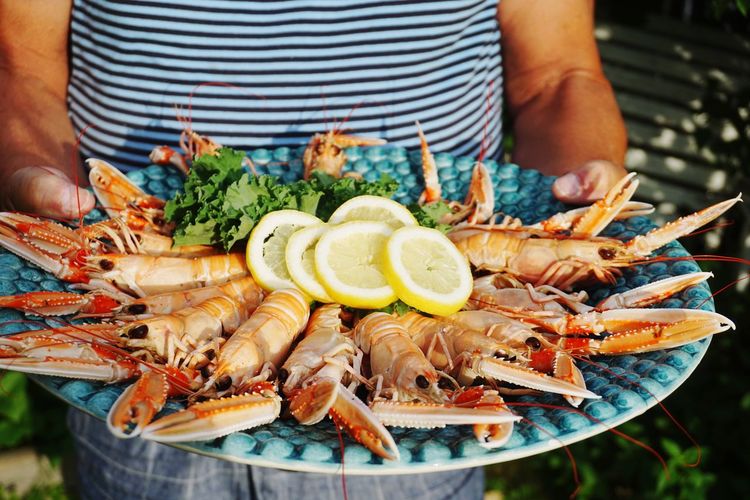 Man serving crayfish