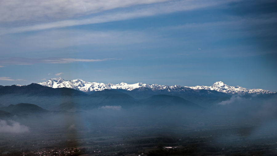 Scenic view of snowcapped mountains against sky