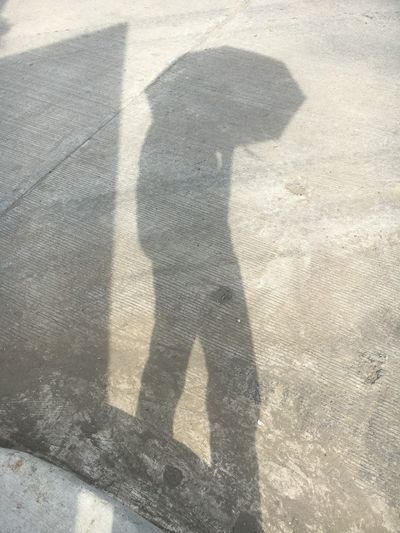 Shadow of people on street