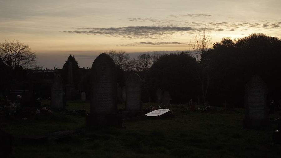 View of cemetery against sky during sunset