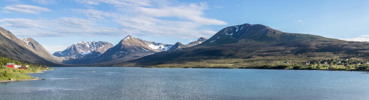 Scenic view of lake by lyngen alps against sky