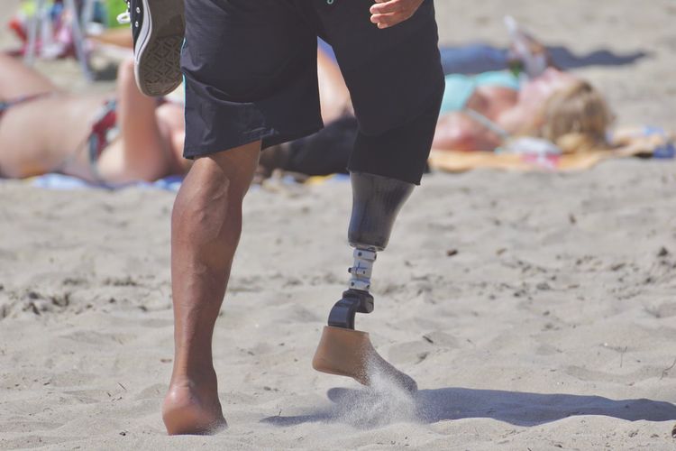 Man with disability on beach