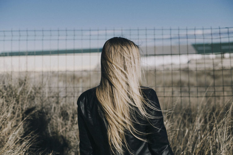 Rear view of woman with long blond hair