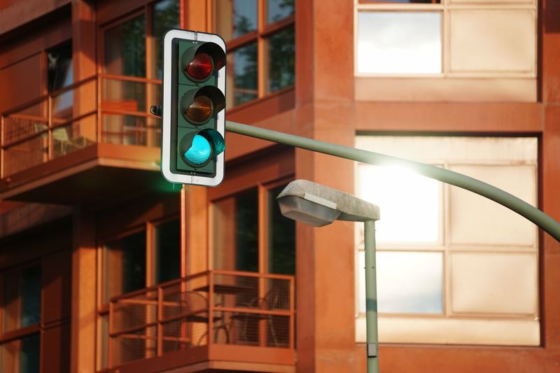 Low angle view of stoplights against building