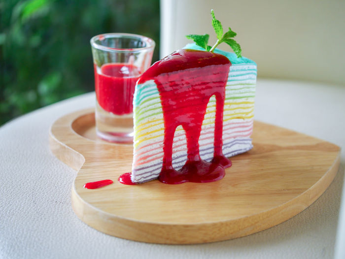 Close-up of colorful cake slice on serving tray