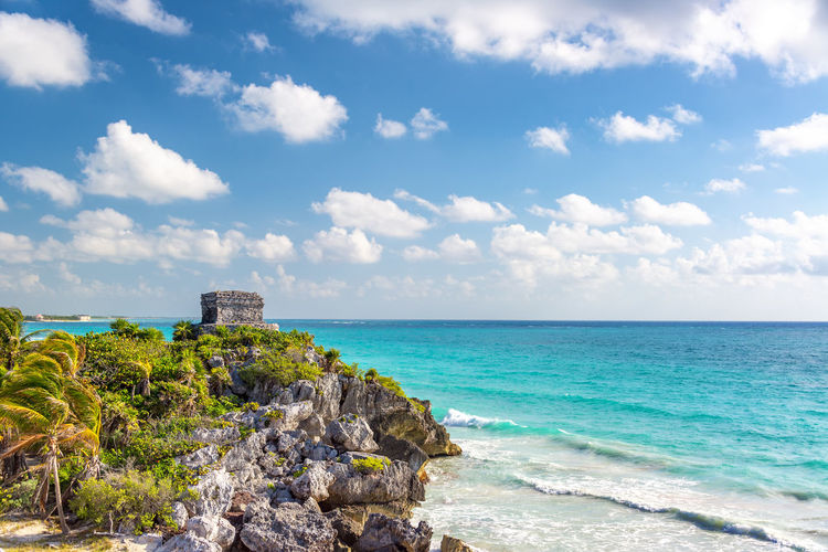 Scenic view of sea against cloudy sky