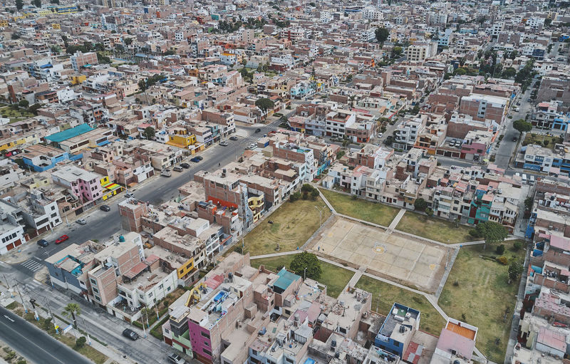 Aerial view of the football field in the middle of a messy neighborhood, callao, lima. peru