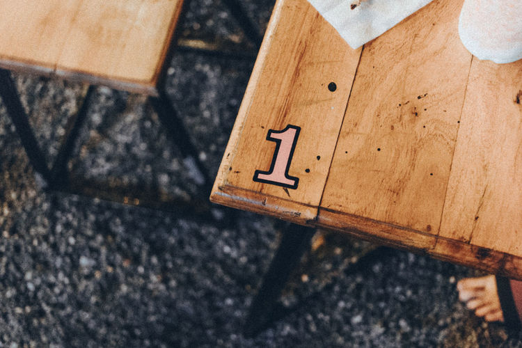 High angle view of number on wooden table
