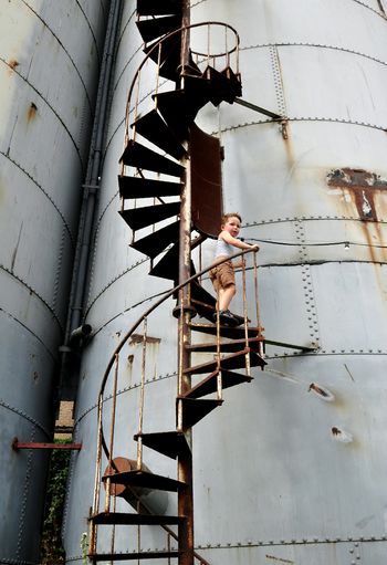 Low angle view of person standing by staircase