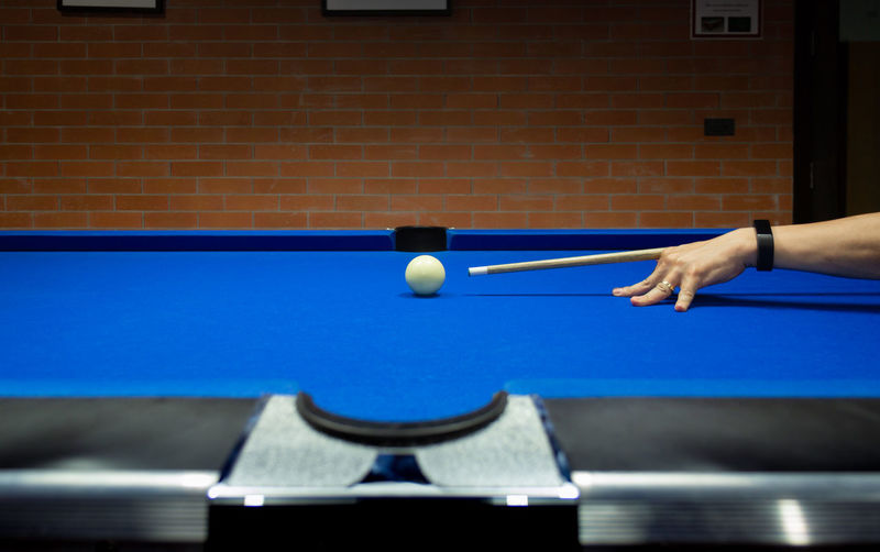 Man playing with ball on table