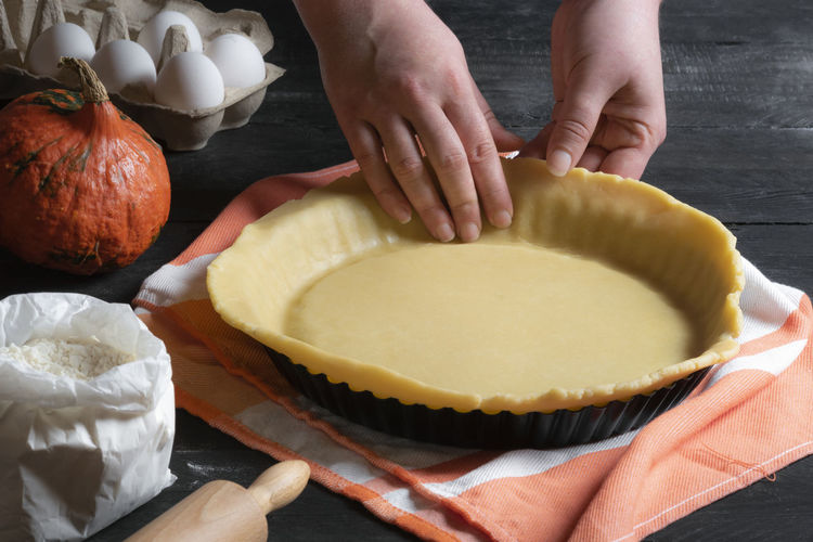 Cropped hands making pie