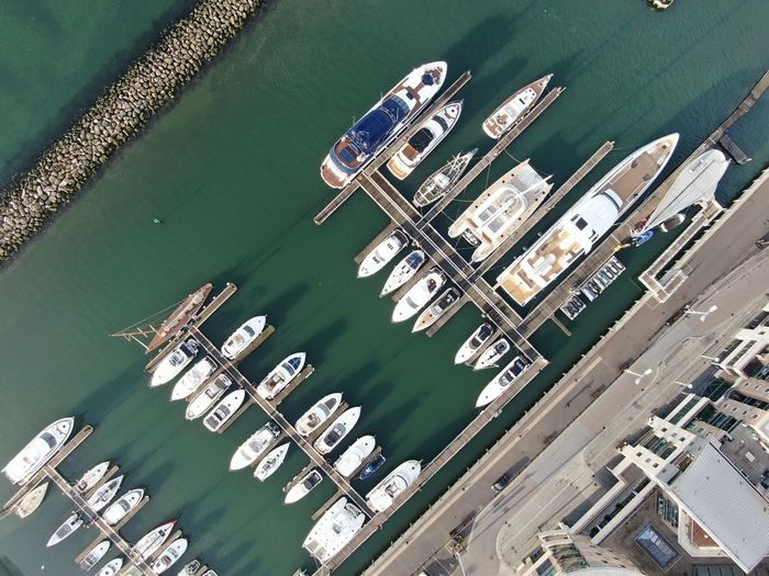 High angle view of boats moored at harbor