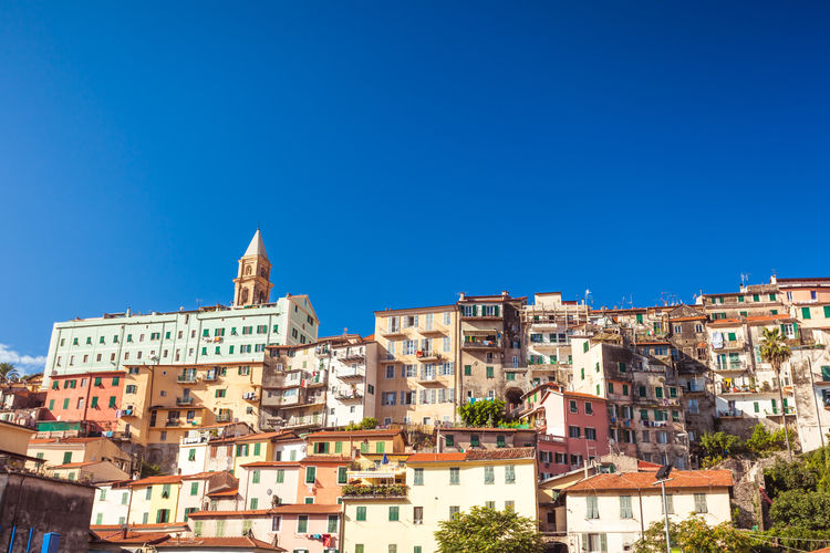 Conglomeration of old vintage colorful houses named borgo in ventimiglia in region liguria