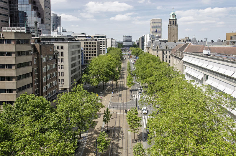 Aerial view along the central coolsingel boulevard, with the tower of the city hall in the distance
