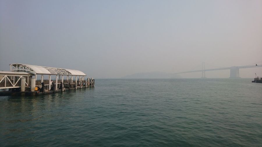 View of bridge over sea against clear sky