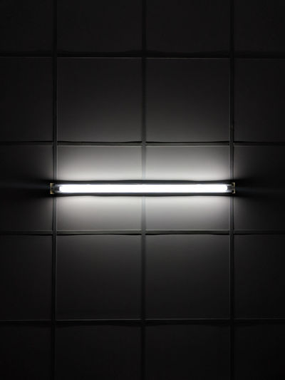 Full frame shot of illuminated lights on wall