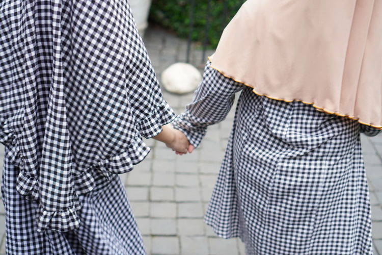 Rear view of couple standing outdoors