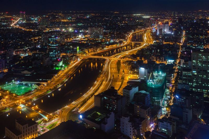 High angle view of illuminated city street at night