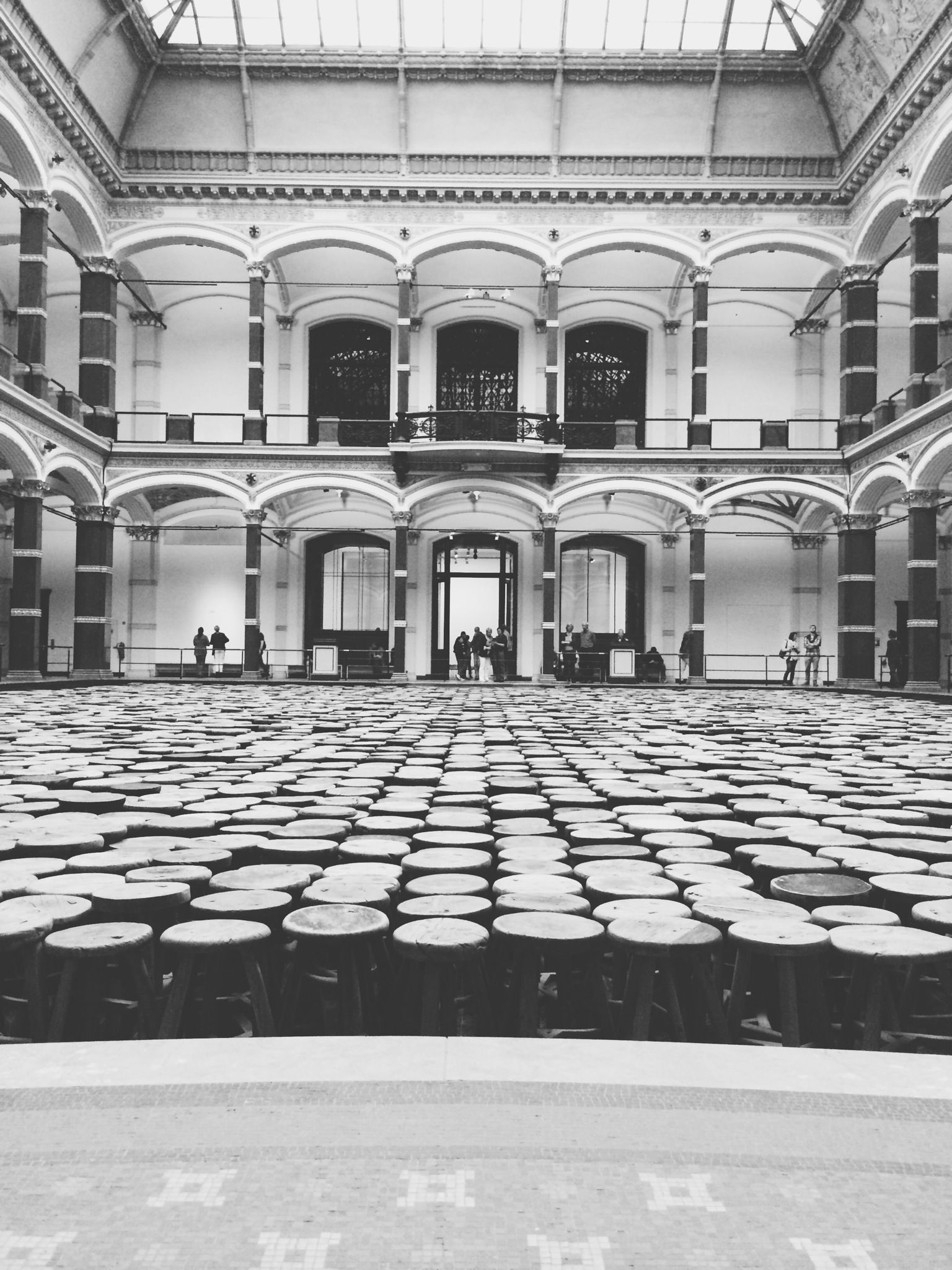 architecture, built structure, building exterior, arch, window, building, in a row, architectural column, indoors, incidental people, empty, day, facade, flooring, architectural feature, cobblestone, sunlight, repetition, city, no people