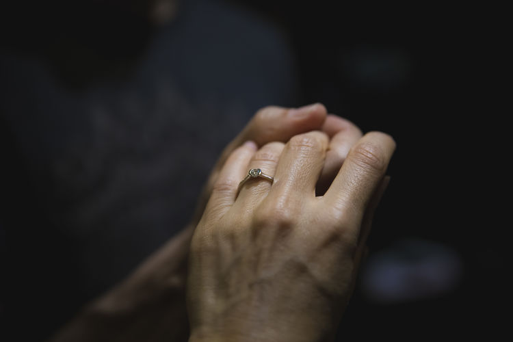 Cropped image of people with holding hands
