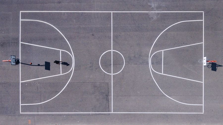 Directly above shot of athlete playing at basketball court
