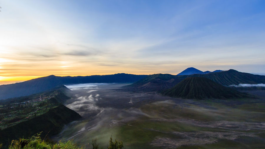 View of volcanic landscape against sky during sunset
