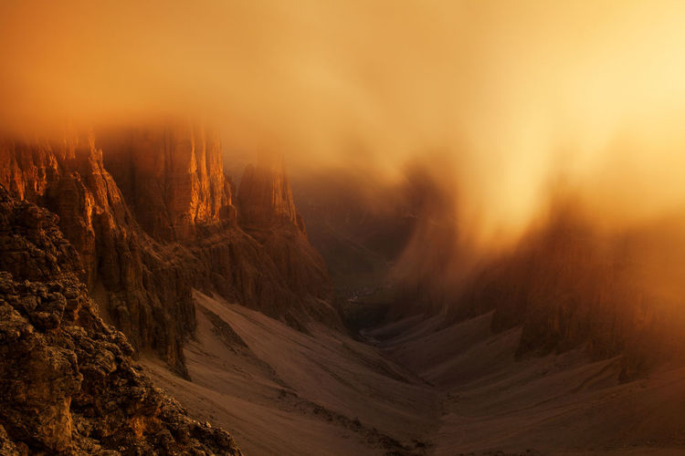 Scenic view of mountains against sky during sunset