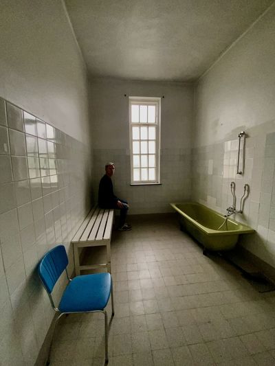 Man in bathroom of building