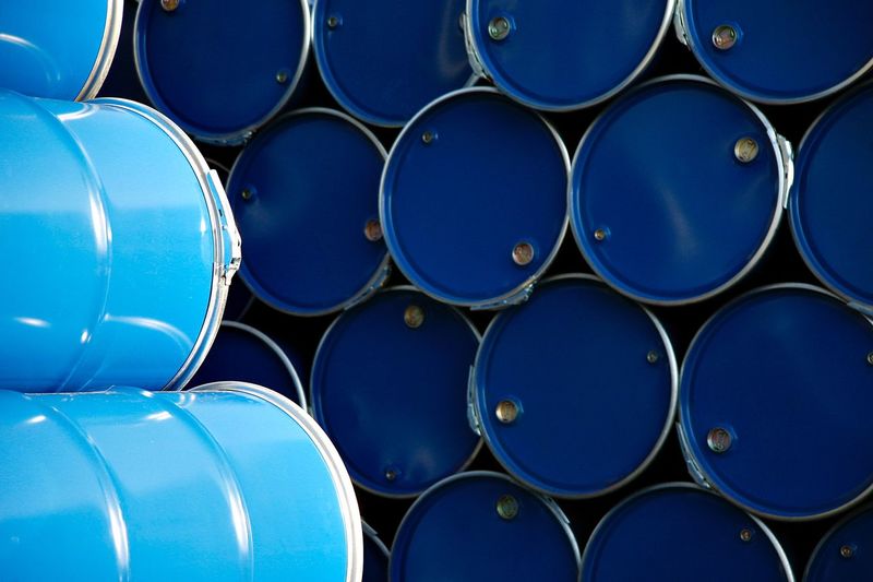 Full frame shot of stacked blue drums in warehouse