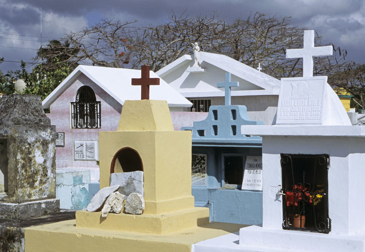 View of cemetery against built structure