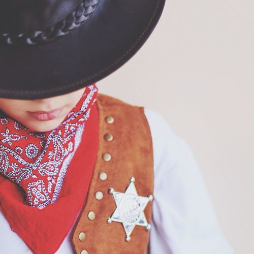 Cropped image of boy in cowboy costume