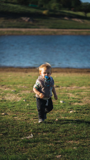 Full length of boy running on land