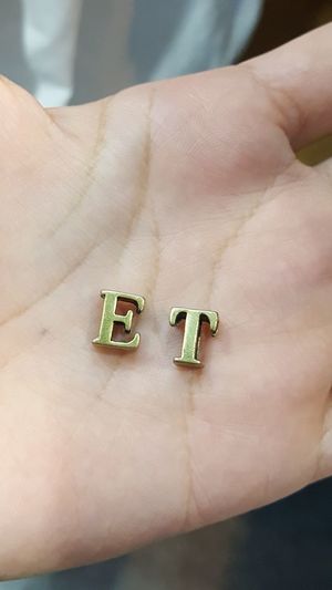 Close-up of letters e and t on palm of hand