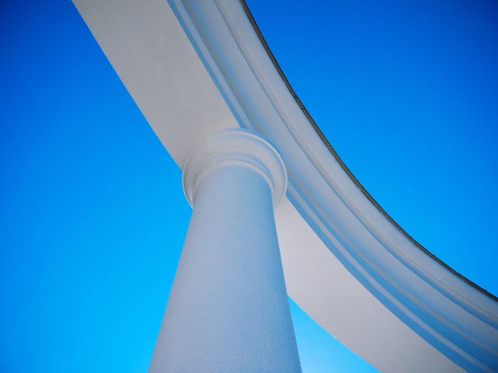 Low angle view of building against clear blue sky