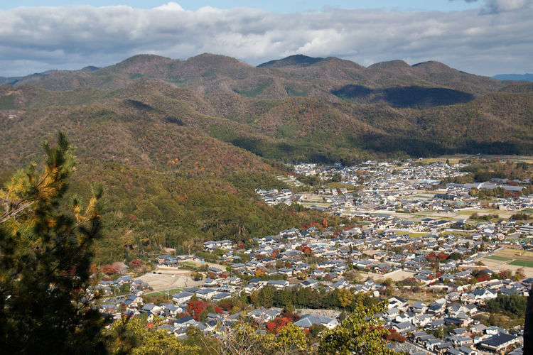 High angle view of townscape against mountain