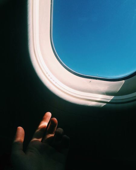 Close-up of blue sky seen through airplane window
