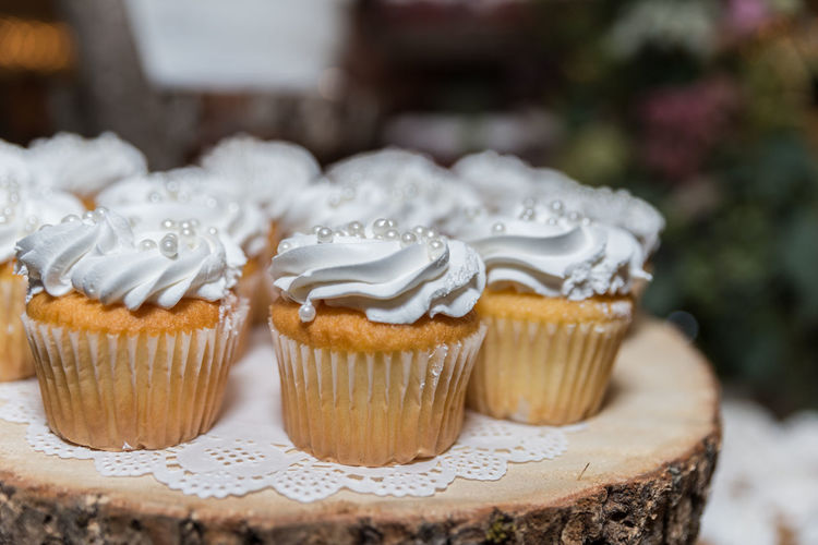 Close-up of cupcakes on wooden table