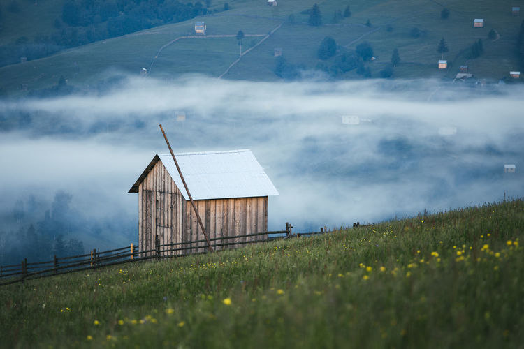 View of hut on field at morning