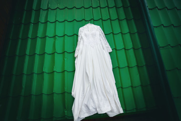 High anlge view of wedding dress on rooftop