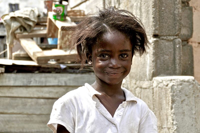 Close-up portrait of smiling girl outdoors