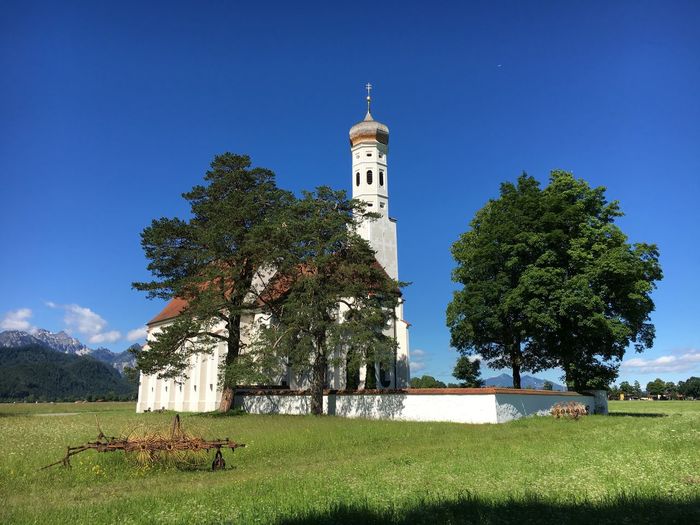 Historic church on field against sky at schwangau