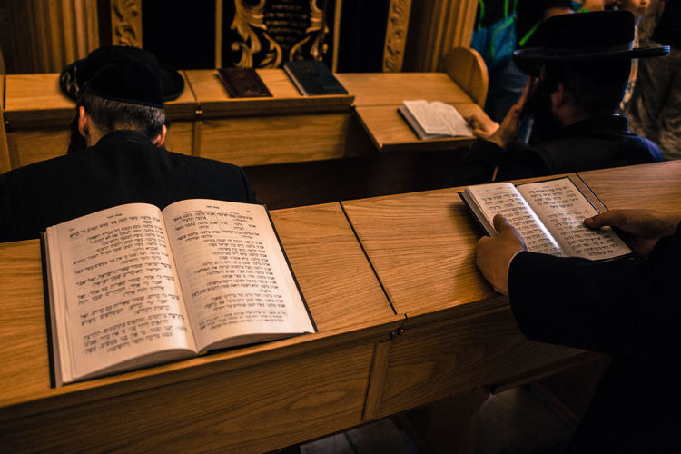 High angle view of jews praying with holy books