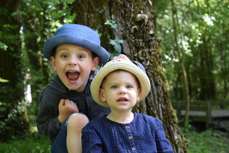 Portrait of happy children in hat