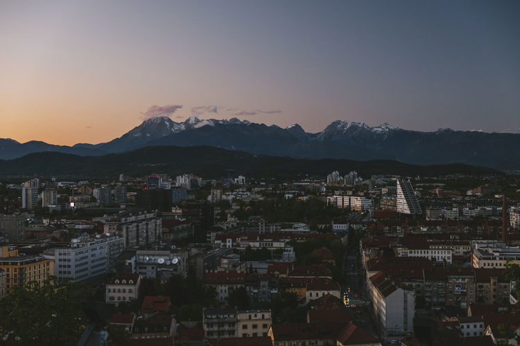 Triglav and julian alps in the background from ljubljana castle at sunset, slovenia.