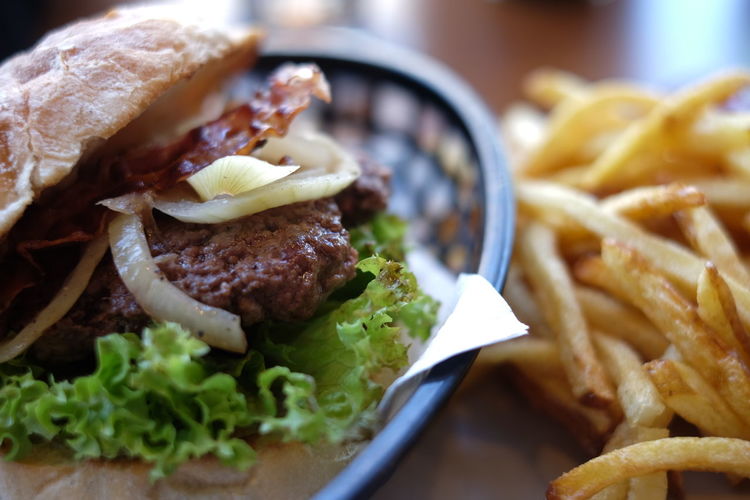 Close-up of hamburger and french fries on table