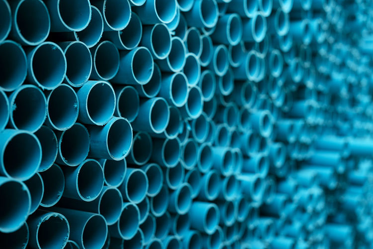 Full frame shot of blue pipes in factory