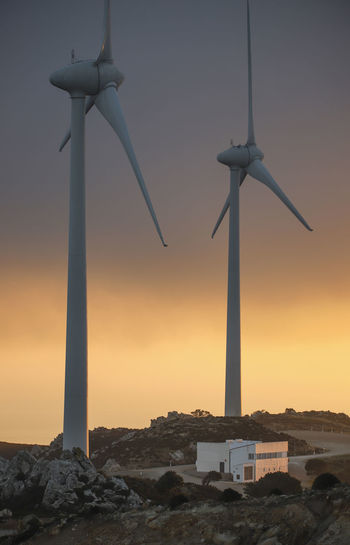 Spain, andalusia, tarifa, two wind wheels at twilight